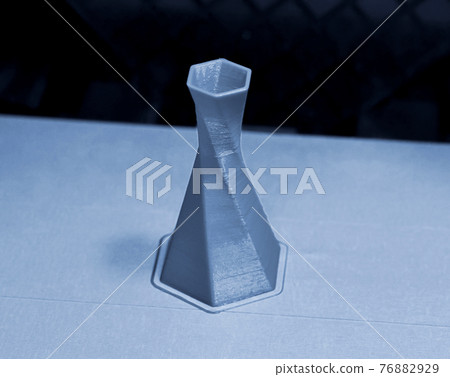 model is printed on the 3D printer close model is printed on the 3D printer close 76882929