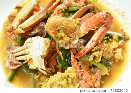stir fried swimmer crab in yellow curry and egg on plate stir fried swimmer crab in yellow curry and egg on plate 76883645