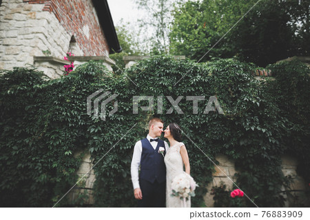 Wedding couple bride and groom holding hands 76883909
