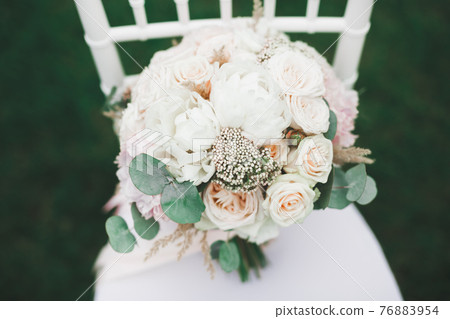 Beautiful wedding bouquet with different flowers, roses 76883954