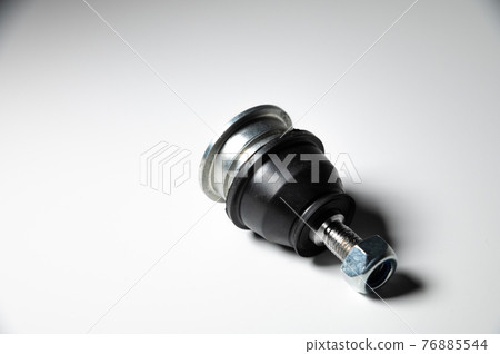 ball joints of the front suspension of a passenger car on a gray background. Service and new parts ball joints of the front suspension of a passenger car on a gray background. Service and new parts 76885544