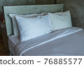 White pillows on a bed Comfortable soft pillows on the bed. 76885577
