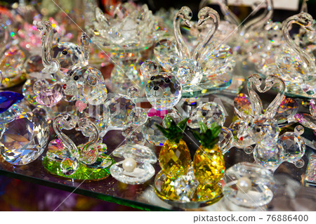 Bohemian glass figurines in showcase 76886400