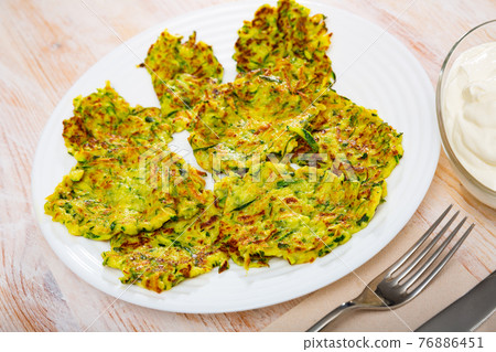 Fried zucchini fritters Fried zucchini fritters 76886451