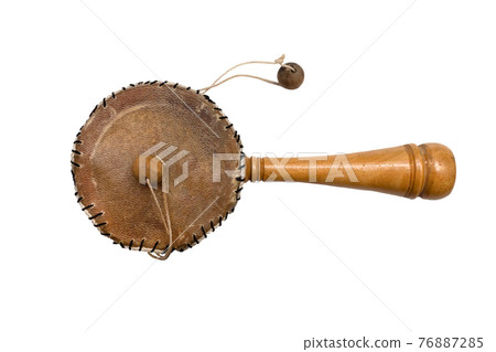 Damaru drum percussion instrument with a handle on a white background. Damaru drum percussion instrument with a handle on a white background. 76887285