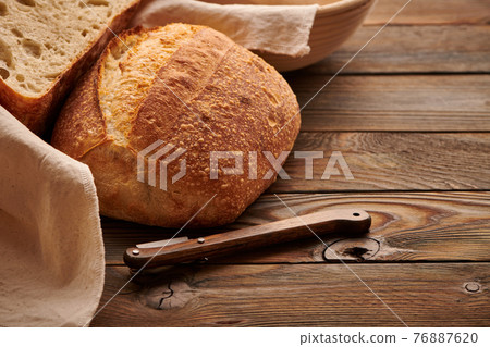 Homemade tartine bread on wooden table 76887620