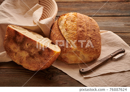 Homemade tartine bread on wooden table 76887624