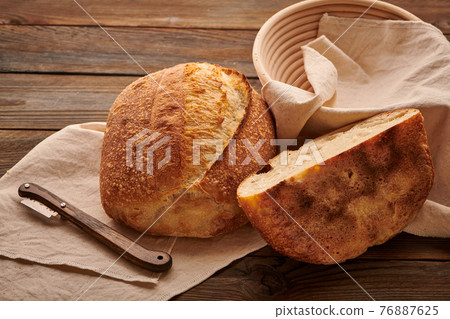 Homemade tartine bread on wooden table 76887625