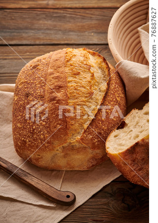 Homemade tartine bread on wooden table Homemade tartine bread on wooden table 76887627