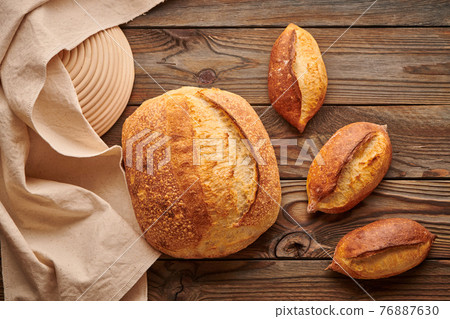 Homemade tartine bread on wooden table 76887630