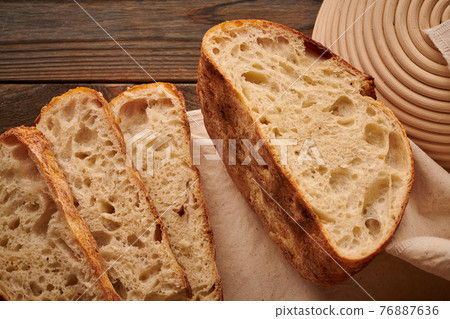 Homemade tartine bread on wooden table Homemade tartine bread on wooden table 76887636