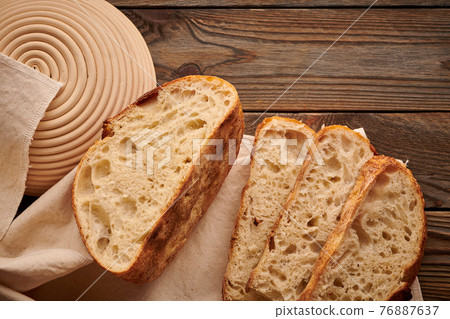 Homemade tartine bread on wooden table 76887637