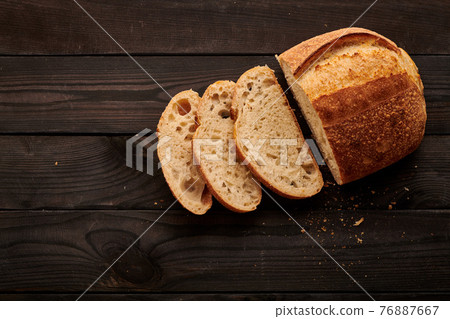 Homemade tartine bread on dark wooden table 76887667