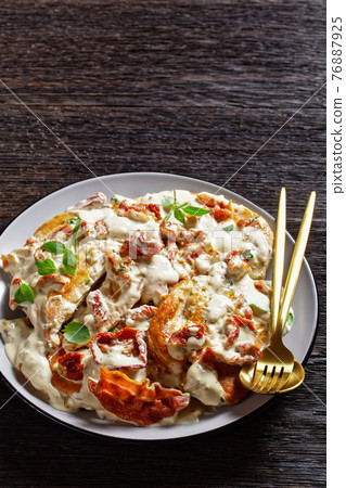 Marry Me Chicken on a plate, top view 76887925