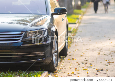 Cars parked on a city street side on pedestrian zone. Cars parked on a city street side on pedestrian zone. 76888984