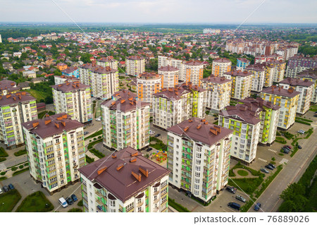 Aerial view of city residential area with high apartment buildings. Aerial view of city residential area with high apartment buildings. 76889026
