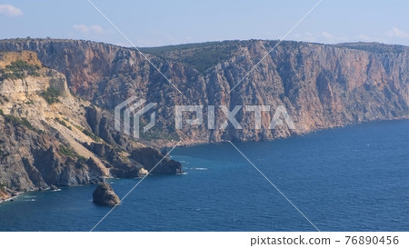 Beautiful view of the coast of the turquoise sea at Cape Fiolent, Crimea. The concept of tranquility 76890456