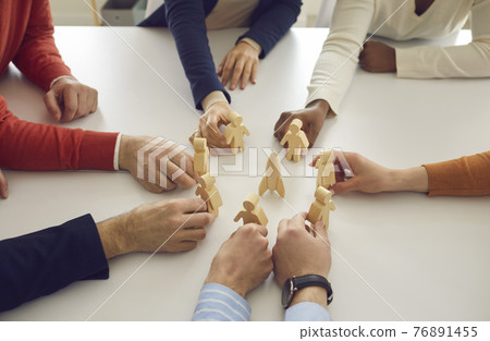 Business people join human figures around space rocket as symbol of launching new product Business people join human figures around space rocket as symbol of launching new product 76891455