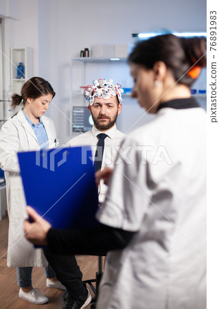 Researcher neurologist doctor asking man's illness symptoms 76891983