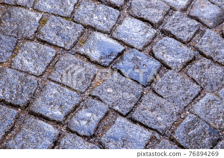 gray stone background smooth cobblestones part of city square 76894269