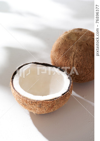Coconut split in half 76896377