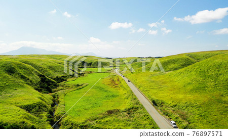 Aerial view of Yamanami Highway in Aso 76897571