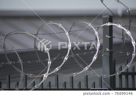 Wire fence that acts as a fence, North Vancouver, British Columbia, Canada Wire fence that acts as a fence, North Vancouver, British Columbia, Canada 76899146