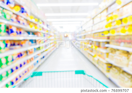 Blurred food and drink on shelf in super market with cart Blurred food and drink on shelf in super market with cart 76899707