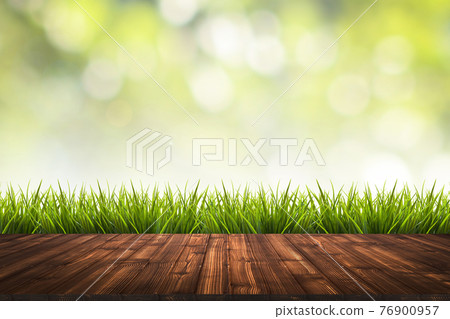 Wooden floor, grass and green blurred background 76900957