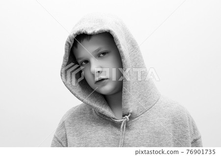 little boy in hood. teenager boy. Child 76901735