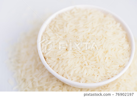 Organic Thai Jasmine rice grain in a bowl prepare for cooking 76902197