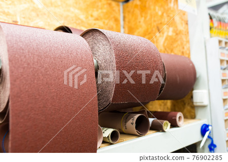 Strips of sandpaper on a shelves in the household store 76902285