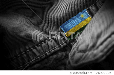 Tag on dark clothing in the form of the flag of the Rwanda Tag on dark clothing in the form of the flag of the Rwanda 76902296