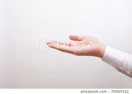 The palm of a businessman who puts something on top, for synthesis 76904592