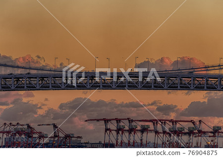 Tokyo Bay and Rainbow Bridge in the evening as seen from Takeshiba, Minato-ku, Tokyo 76904875
