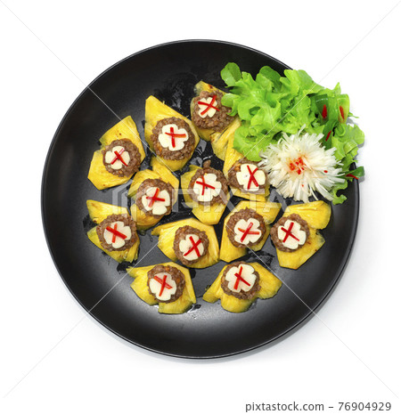 Thai Appetizer Pineapple Fruits Served with Sweet and Savory Peanut and Minced Pork Sauce 76904929