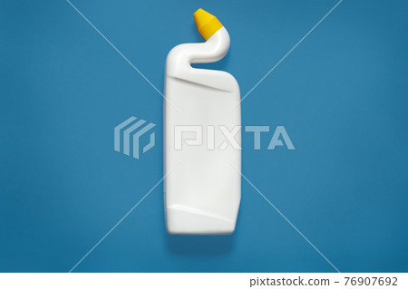 Front view of white plastic bottle of toilet cleaner with yellow cap isolated over blue background. Blank plastic detergent bottle. Empty space for promotional text or advertisment. Mock up. Front view of white plastic bottle of toilet cleaner with yellow cap isolated over blue background. Blank plastic detergent bottle. Empty space for promotional text or advertisment. Mock up. 76907692