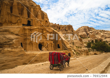 Horse cart and Obelisk Tomb, a Nabataean monument in petra, jordan 76912944