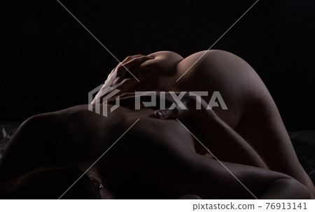 Photo of man grabbing female buttocks in shadows 76913141