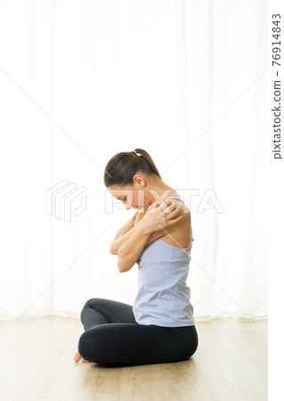 Portrait of gorgeous active sporty young woman practicing breathing exercises in yoga studio. Healthy active lifestyle, working out indoors in gym Portrait of gorgeous active sporty young woman practicing breathing exercises in yoga studio. Healthy active lifestyle, working out indoors in gym 76914843