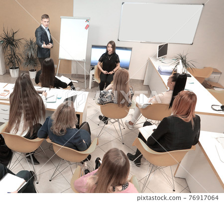 confident businessman explaining something on whiteboard during conference confident businessman explaining something on whiteboard during conference 76917064