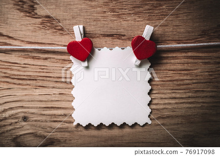 blank note on clothespin on wooden background. blank note on clothespin on wooden background. 76917098