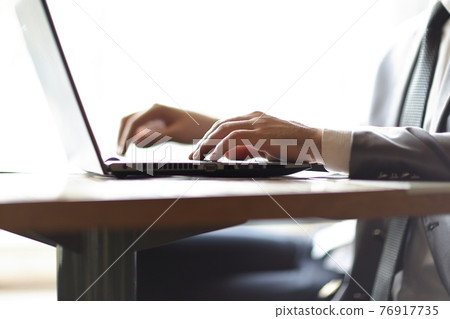 close up.businessman typing text on laptop. people and technology close up.businessman typing text on laptop. people and technology 76917735