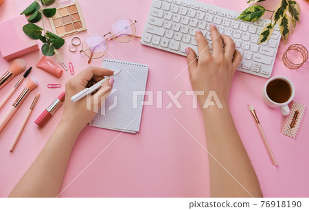 Women table with coffee, office supplies, pink makeup brushes 76918190
