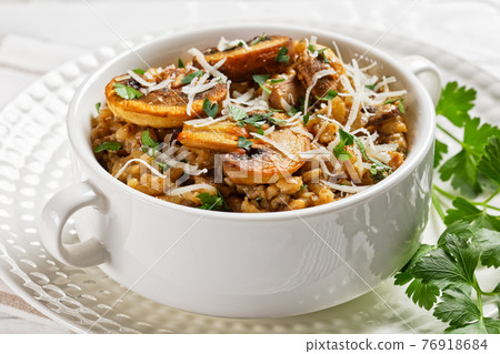 classic creamy mushroom risotto in a bowl 76918684