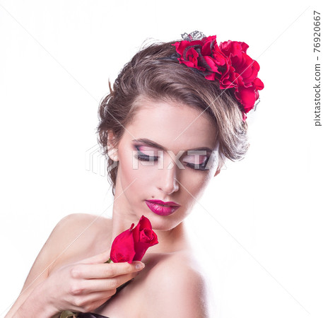 beautiful young woman in evening dress . isolated on white 76920667