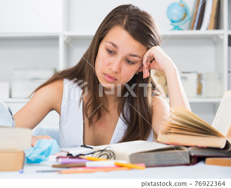 Female teenager is solving an equation Female teenager is solving an equation 76922364