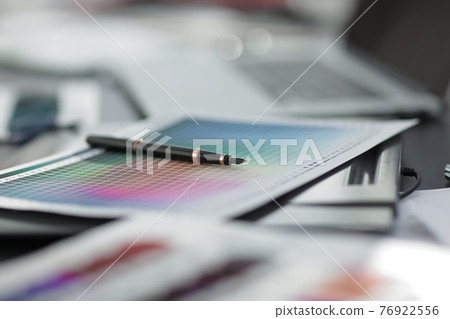 blurred image of a blueprint and a pen on the designer's Desk 76922556