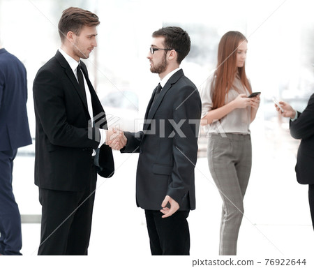 close up.welcome handshake of business people in the office close up.welcome handshake of business people in the office 76922644