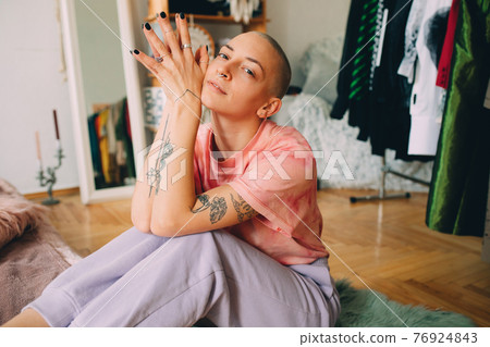 Woman in domestic clothes take a rest at home at the weekend Woman in domestic clothes take a rest at home at the weekend 76924843